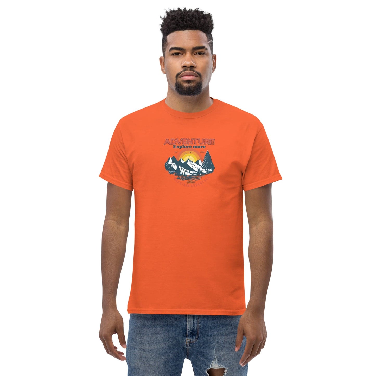 Orange t-shirt with mountain graphic.